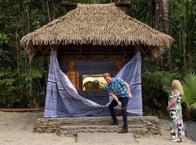 The Duke of Sussex unveils a plaque during a dedication of the Colo-i-Suva forest to the Queen’s Commonwealth Canopy in Suva, Fiji, Wednesday, Oct. 24, 2018. (Dominic Lipinski/Pool Photo via AP)