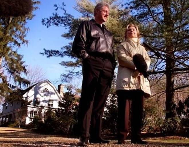 FILE - In this Jan. 6, 2000 file photo, Bill and Hillary Clinton stand in the driveway of their new home in Chappaqua, N.Y. A U.S. official says a “functional explosive device” was found at Hillary and Bill Clinton’s suburban New York home. (AP Photo, File)