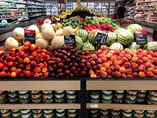 In this June 14, 2018, file photo, nectarines, plums, mangos and peaches are marked at a fruit stand in a grocery store in Aventura, Fla. THE CANADIAN PRESS/AP/Brynn Anderson