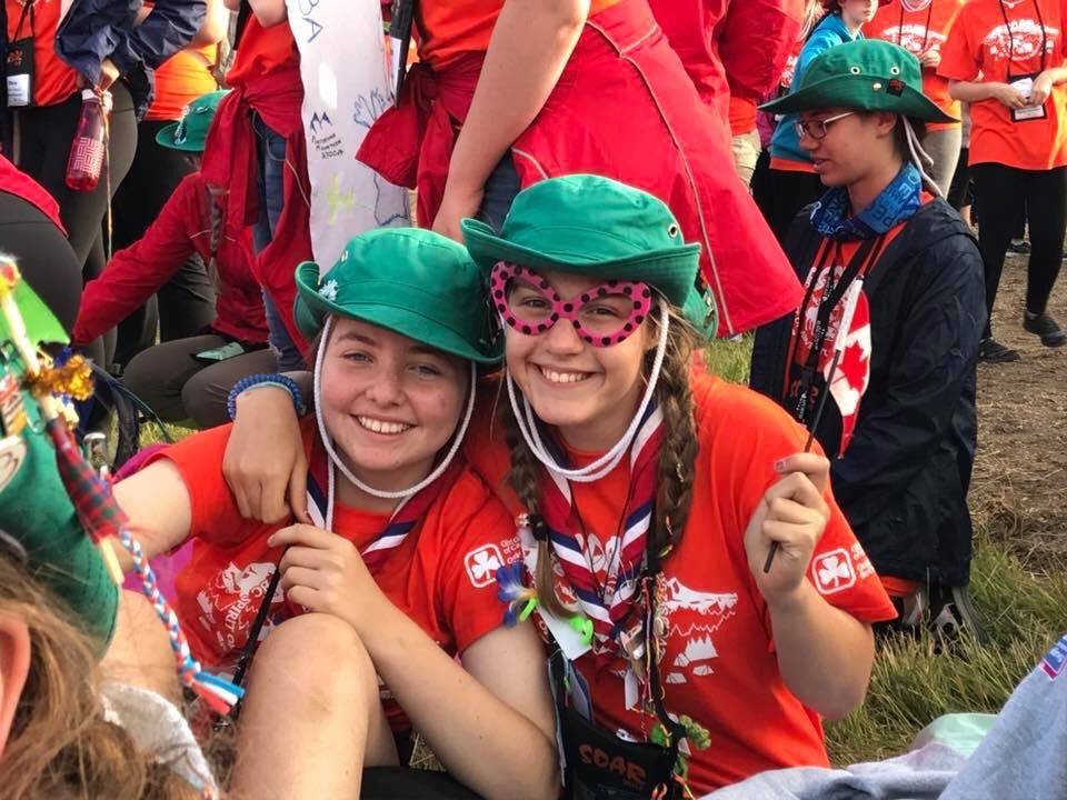 International Girl Guides wave Canadian flag. (contributed photo)