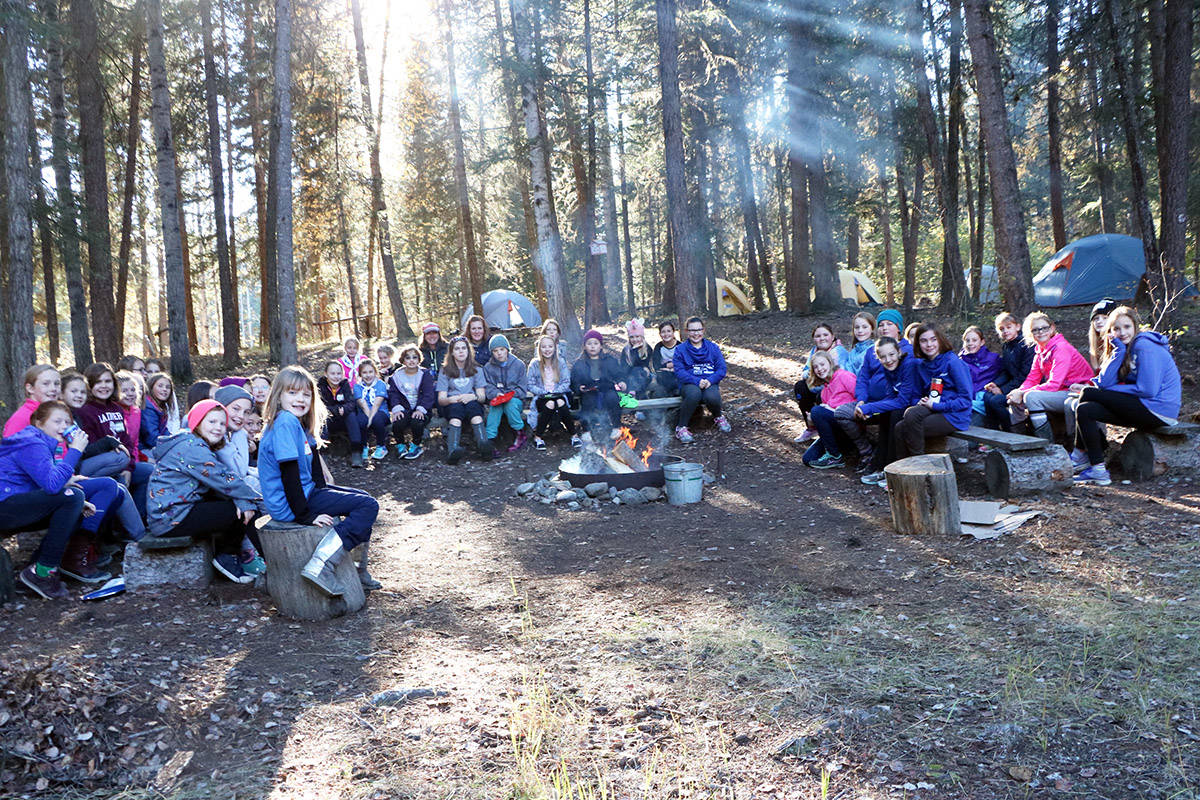 The Williams Lake Girl Guides sitting around a campfire at Tyee Lake Camp. (Phot by patrick Davies)