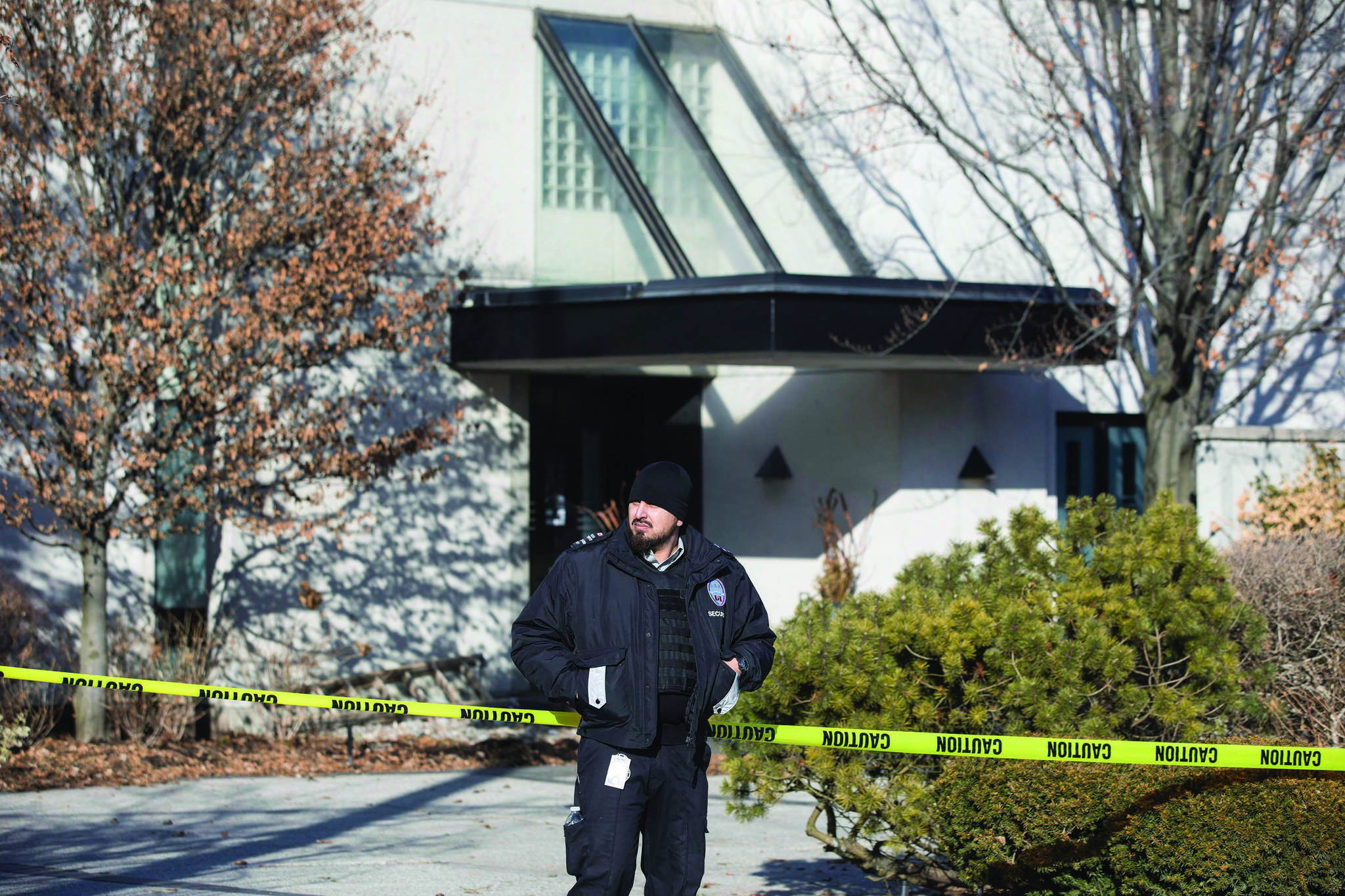 A private security guard stands outside the Toronto home of Barry and Honey Sherman on Friday, January 26, 2018. Billionaire generic drug tycoon Barry Sherman and his wife Honey were victims of a targeted double killing but no suspects have been identified, Toronto police said on Friday. (Chris Young/The Canadian Press)