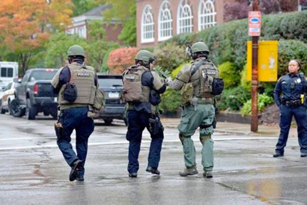 Police respond to an active shooter situation at the Tree of Life synagogue on Wildins Avenue in the Squirrel Hill neighborhood of Pittsburgh, Pa., on Saturday, October 27, 2018. (Pam Panchak/Pittsburgh Post-Gazette via AP)