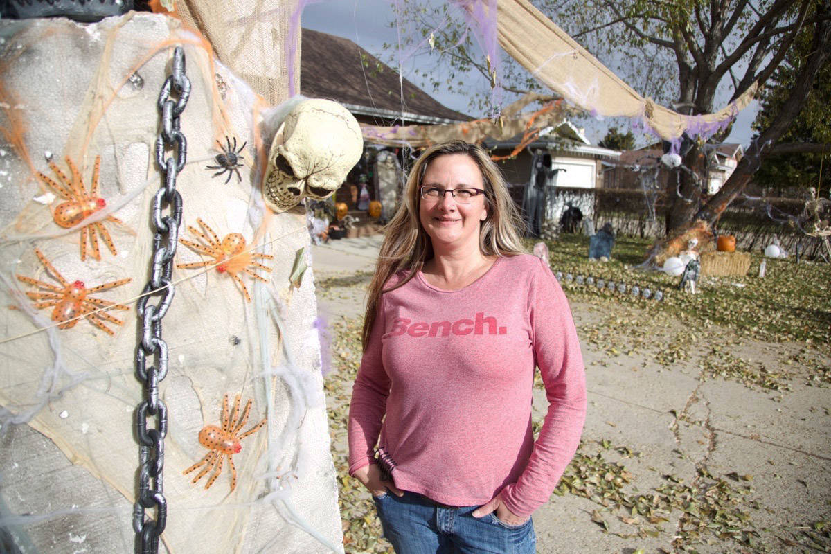 Sonja Hoefman stands in front of her lawn on Nordegg Crescent that she decorates for Halloween each year. In total, the lawn and driveway have about 80 spooky creatures to make Trick-Or-Treaters jump in fear this Halloween. Robin Grant/Red Deer Express