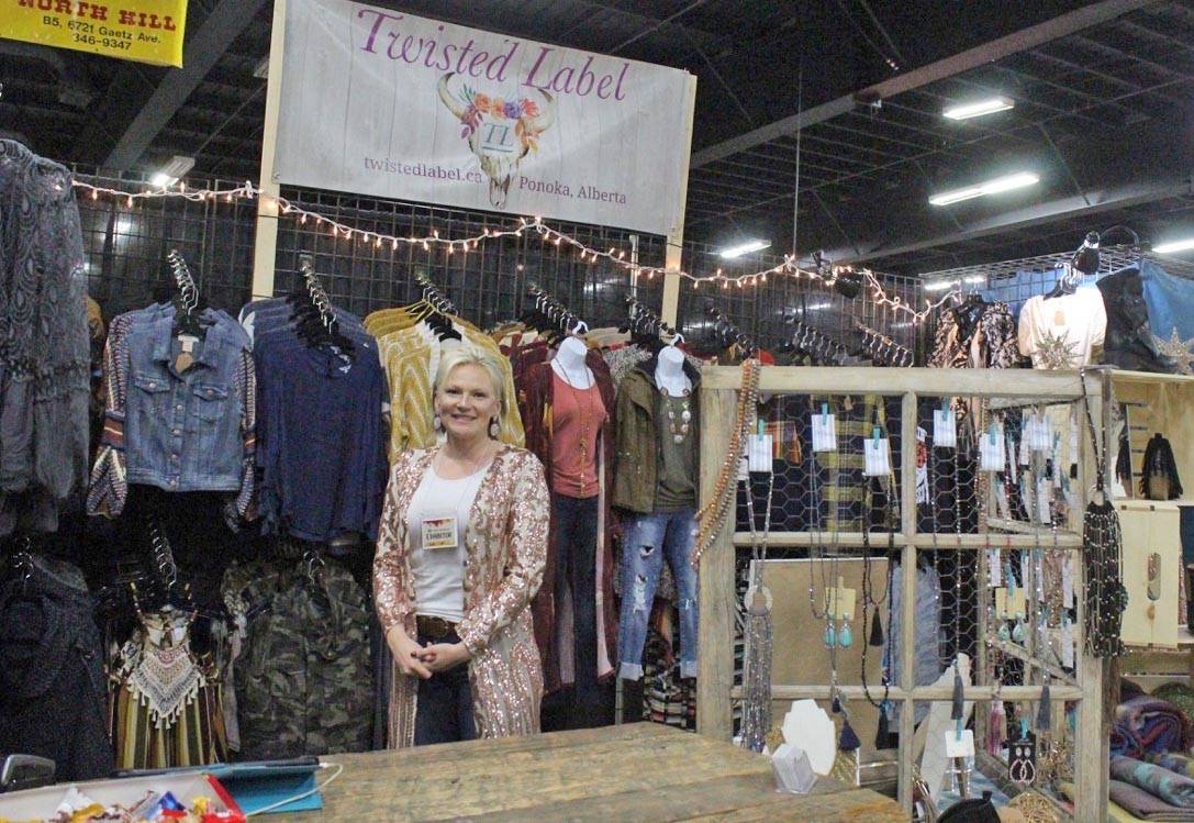 Kris Millar, owner of Twisted Label in Ponoka, stands in front of her display at the CFR Tradeshow, which runs at Westerner Park until Nov. 4th. Carlie Connolly/Red Deer Express
