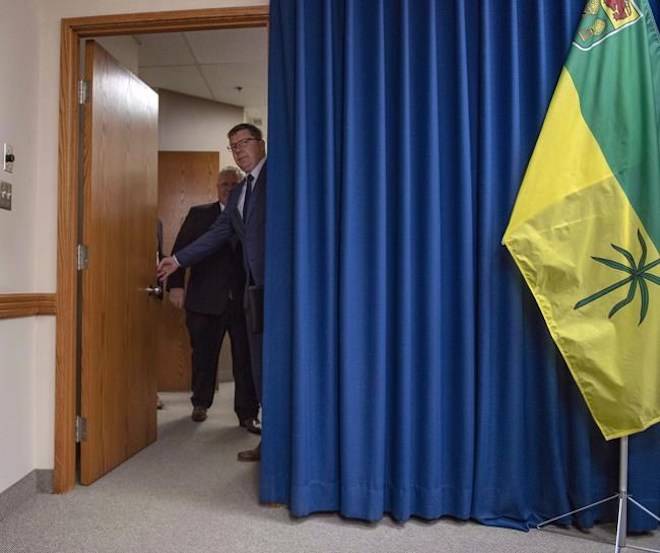 Premier of Saskatchewan Scott Moe, right, opens the door with Premier of Ontario Doug Ford prior to a media event in Saskatoon, Thursday, October 4, 2018. Liam Richards / THE CANADIAN PRESS