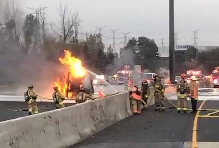 Emergency crews attend a fire after an accident on highway 407, as shown in this still image taken from a video provided by Ontario Provincial Police Sgt. Kerry Schmidt, in Toronto on Wednesday Oct. 31, 2018. Officials say two people have been killed in a multi-vehicle crash that sparked a tanker fire on a major toll highway in the Toronto area. THE CANADIAN PRESS/HO-Ontario Provincial Police-Sergeant Kerry Schmidt