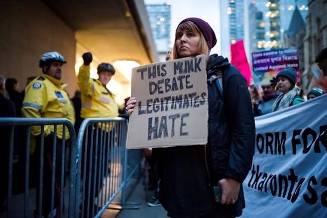 Protesters delay debate involving ex-Trump strategist Steve Bannon