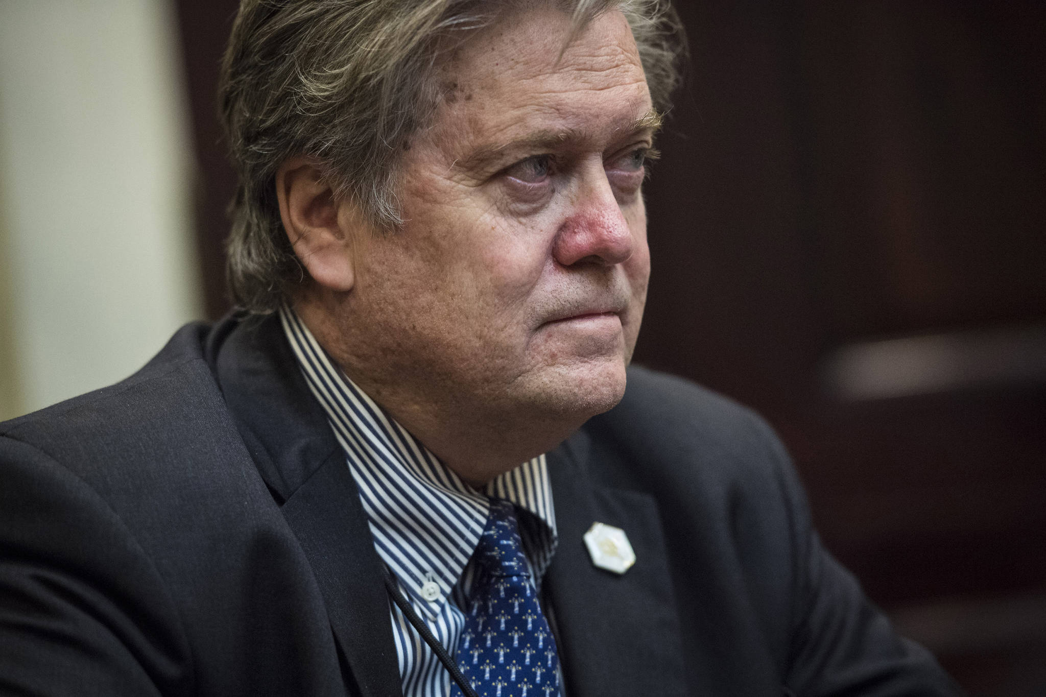 12 charged after protest of debate featuring ex-Trump aide Steve Bannon