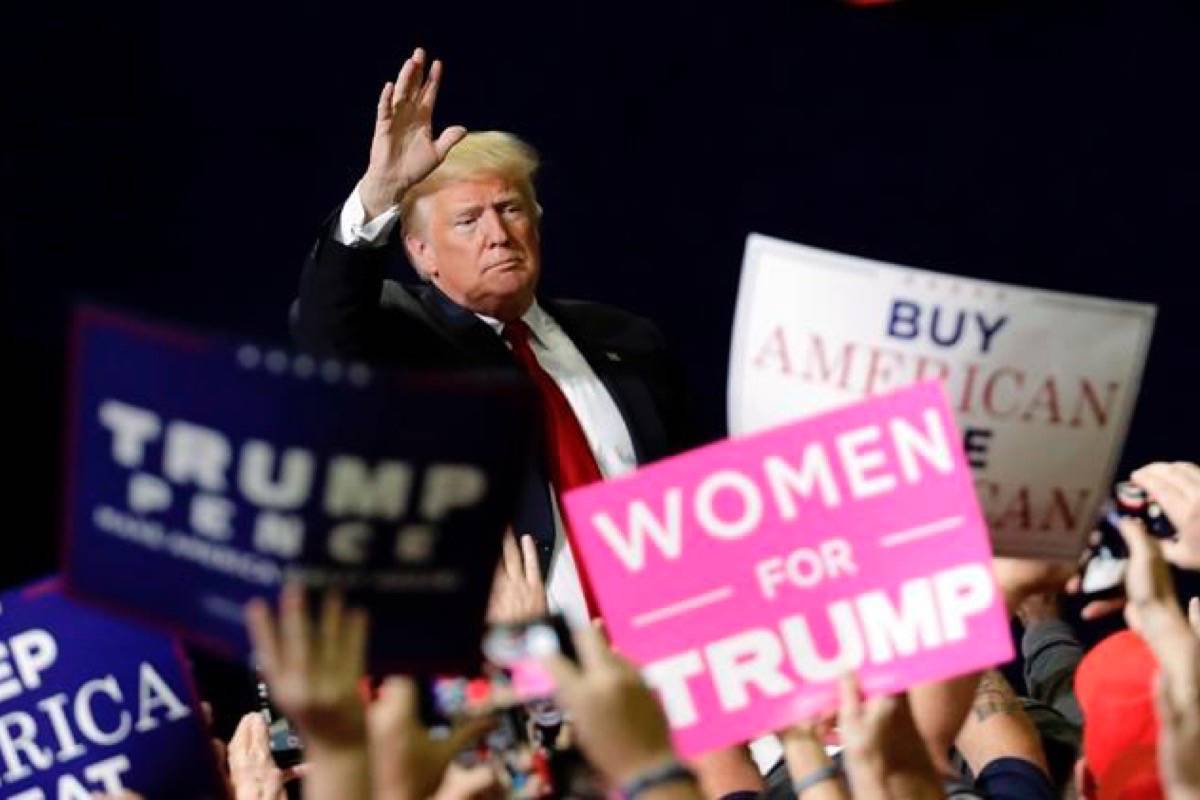 President Donald Trump acknowledges the crowd as he leaves a rally Sunday, Nov. 4, 2018, in Chattanooga, Tenn. With voter turnout in the U.S. expected to test record levels Tuesday, women are expected to vote in the midterm elections en masse, energized by widespread anger towards Donald Trump. (Mark Humphrey/AP)