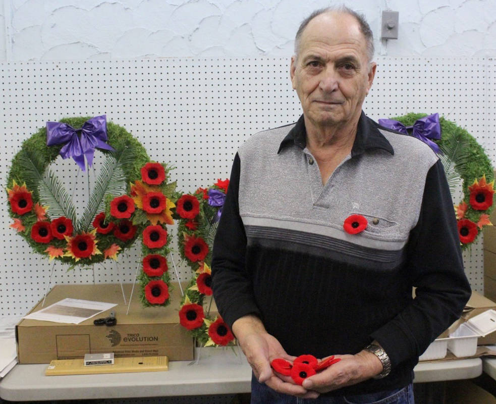 Neil St. Denys stands with his collection of poppies at the temporary location of the Red Deer Legion. Carlie Connolly/Red Deer Exoress