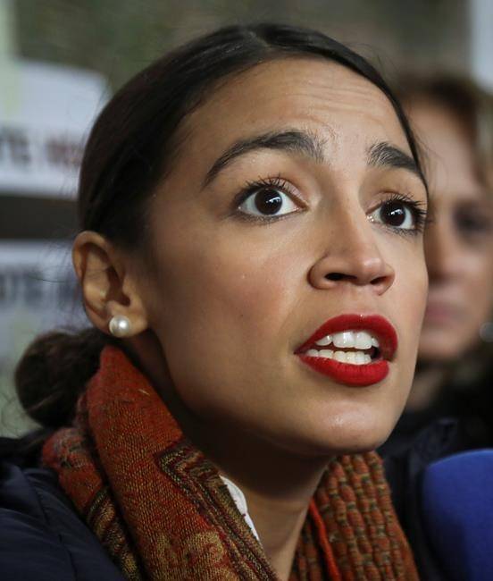 New York Democratic congressional candidate Alexandria Ocasio-Cortez speaks with reporters after voting, Tuesday Nov. 6, 2018, in the Parkchester community of the Bronx, N.Y. (AP Photo/Bebeto Matthews)