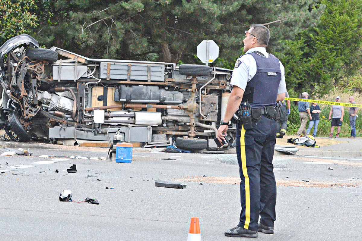 Emergency responders in 2014 responded to the collision between an RCMP cruiser and the van of a tourist family from Calgary. (Langley Advance files)