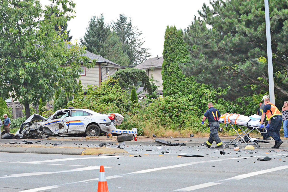 Emergency responders in 2014 responded to the collision between an RCMP cruiser and the van of a tourist family from Calgary. (Langley Advance files)