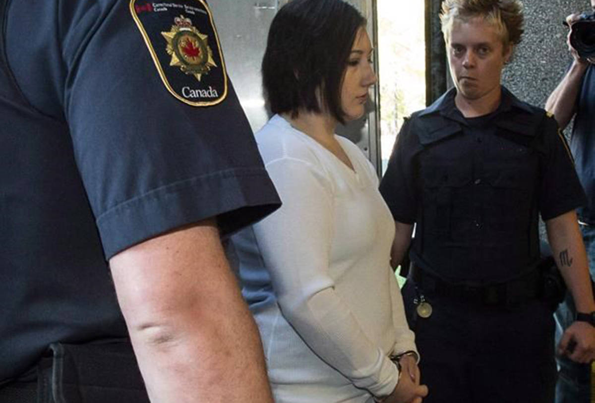 Terri-Lynne McClintic, convicted in the death of 8-year-old Woodstock, Ont., girl Victoria Stafford, is escorted into court in Kitchener, Ont., on Wednesday, September 12, 2012 for her trial in an assault on another inmate while in prison. The father of a young girl who was brutally murdered says one of her killers who was spending time in an Indigenous healing lodge is back in prison. THE CANADIAN PRESS/ Geoff Robins