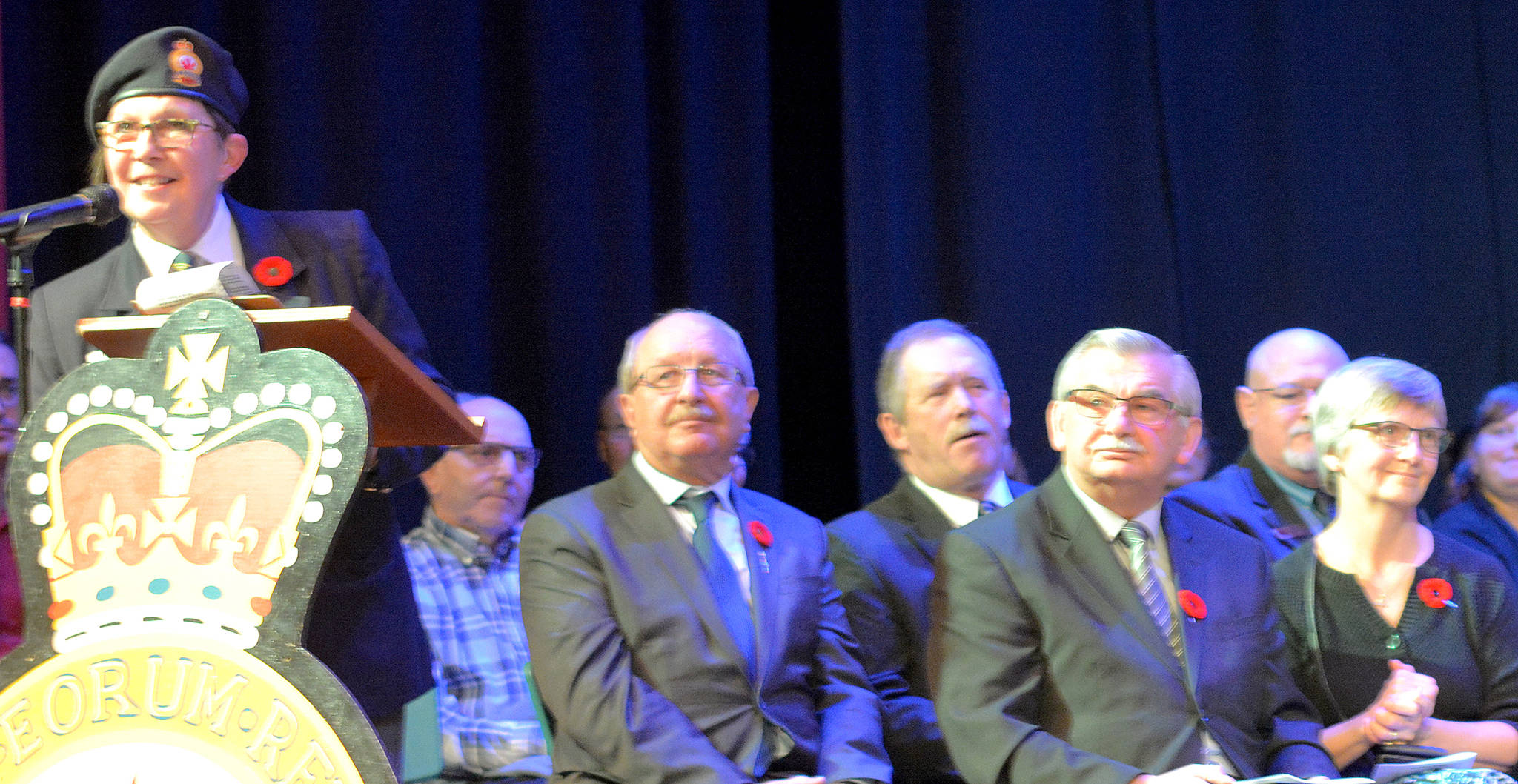 Rosalind LaRose MC’s Stettler’s Remembrance Day Service Nov. 11. Seated are, from left, Drumheller - Stettler MLA Rick Strankman, Stettler County Reeve Larry Clarke, Town of Settler Deputy Mayor Gord Lawlor, and in the front, Pastor Ross Helgeton. (Lisa Joy/Stettler Independent)