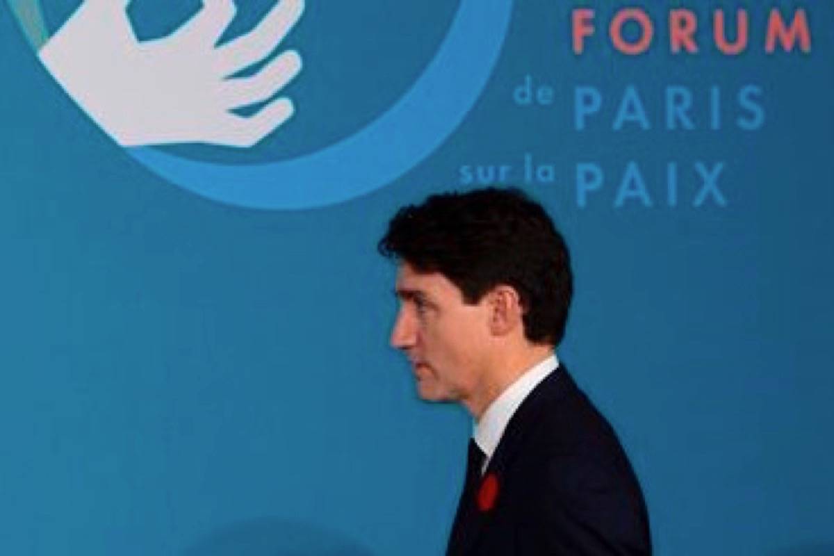 Prime Minister Justin Trudeau takes his seat for a session at the Paris Peace Forum in Paris, France, Sunday, November 11, 2018. (THE CANADIAN PRESS/Adrian Wyld)