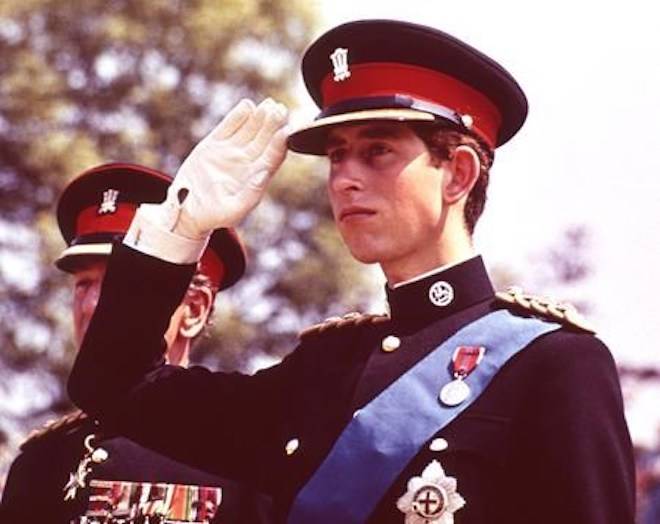 FILE - In this June 11, 1969 file photo, Britain’s Prince Charles, the Prince of Wales, in the uniform of the Colonel in Chief of the Royal Regiment of Wales, salutes during the Regiment’s Colour presentation, at Cardiff Castle in Wales. It was the first occasion for the Prince to wear uniform. (AP Photo, File)