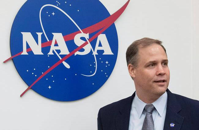 Administrator of the National Aeronautics and Space Administration (NASA) Jim Bridenstine enters the hall before a news conference at the U.S. embassy in Moscow in Moscow, Russia, Friday, Oct. 12, 2018. (Pavel Golovkin/The Canadian Press)