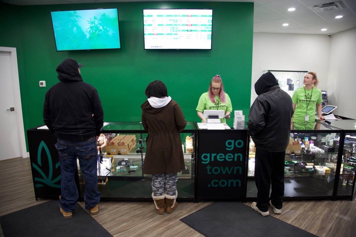 Shoppers order cannabis and other weed-related products at Green Town Thursday morning. The fully licensed pot retailer was the first in Red Deer to open. Robin Grant/Red Deer Express