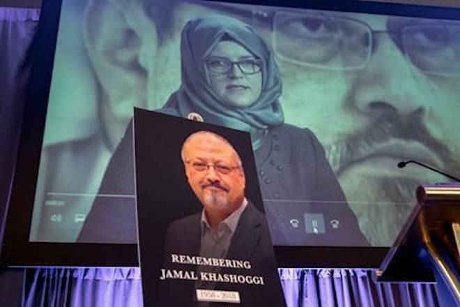 FILE - In this Friday, Nov. 2, 2018 file photo, a video image of Hatice Cengiz, fiancee of slain Saudi journalist Jamal Khashoggi, is played during an event to remember Khashoggi, who was killed inside the Saudi Consulate in Istanbul on Oct. 2, in Washington. (AP Photo/J. Scott Applewhite, File)