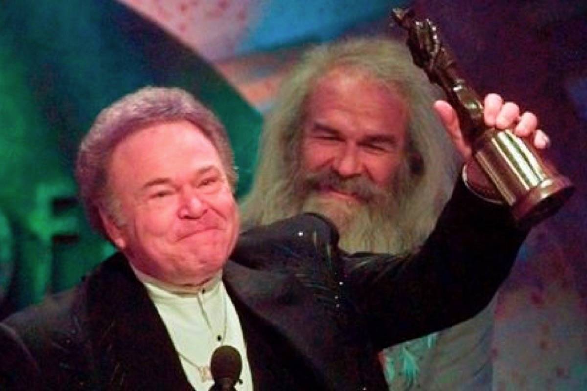 In this April 23, 1997, file photo, musician Roy Clark celebrates after receiving the Pioneer Award at the Academy of Country Music Awards in Universal City, Calif. (AP Photo/Reed Saxon, File)