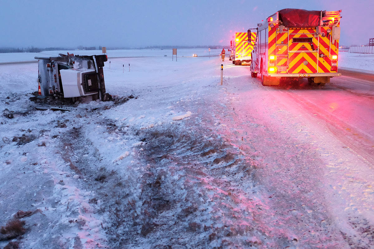 Members of the Ponoka County East District Fire Department were called to a semi rollover Friday morning on QE2 just north of Highway 53. Highway conditions at the time were slick. Just south of this incident a semi tractor hauling a flat deck trailer was in the east ditch. Photo by Jeffrey Heyden-Kaye                                 Members of the Ponoka County East District Fire Department were called to a semi rollover Friday morning on QE2 just north of Highway 53. Highway conditions at the time were slick. Just south of this incident a semi tractor hauling a flat deck trailer was in the east ditch. Photo by Jeffrey Heyden-Kaye