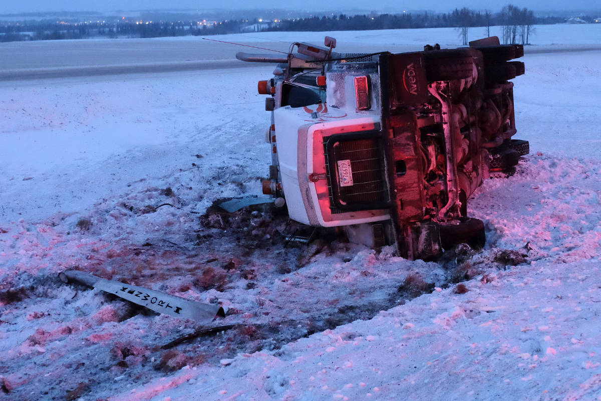 Members of the Ponoka County East District Fire Department were called to a semi rollover Friday morning on QE2 just north of Highway 53. Highway conditions at the time were slick. Just south of this incident a semi tractor hauling a flat deck trailer was in the east ditch. Photo by Jeffrey Heyden-Kaye                                 Members of the Ponoka County East District Fire Department were called to a semi rollover Friday morning on QE2 just north of Highway 53. Highway conditions at the time were slick. Just south of this incident a semi tractor hauling a flat deck trailer was in the east ditch. Photo by Jeffrey Heyden-Kaye