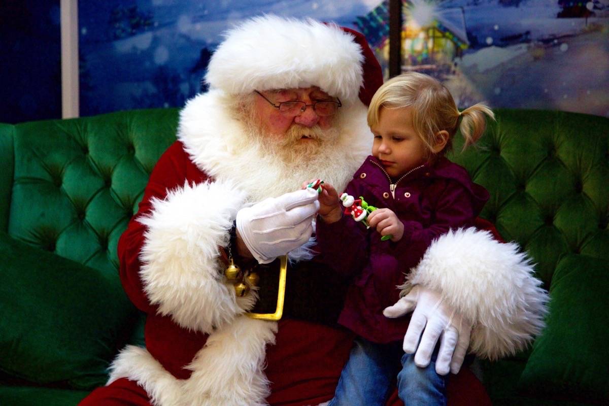 Elizabeth Thompson, 3, visits with Santa Claus on Saturday morning at Bower Place Shopping Centre. Robin Grant/Red Deer Express
