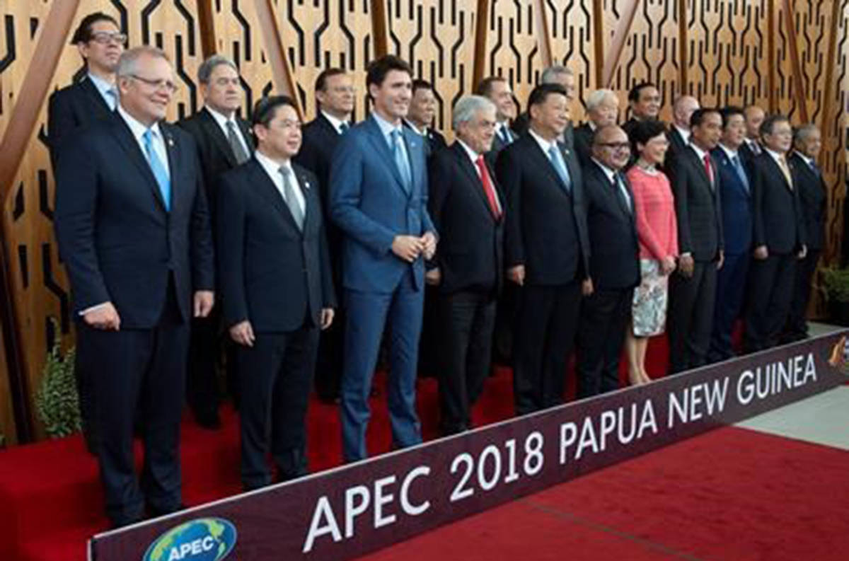 Canadian Prime Minister Justin Trudeau (third from left) and other leaders participate in an APEC Leaders’ Official Photograph in Port Moresby, Papa New Guinea Saturday November 17, 2018. THE CANADIAN PRESS/Adrian Wyld