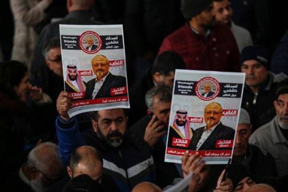 The members of Arab-Turkish Media Association and friends hold posters as they attend funeral prayers in absentia for Saudi writer Jamal Khashoggi who was killed last month in the Saudi Arabia consulate, in Istanbul, Friday, Nov. 16, 2018. Turkey’s Foreign Minister Mevlut Cavusoglu on Thursday called for an international investigation into the killing of the Saudi dissident writer Jamal Khashoggi.(AP Photo/Emrah Gurel)