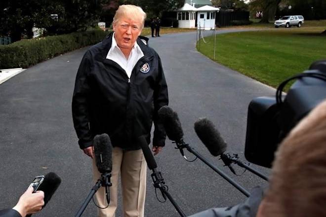 President Donald Trump answers questions from members of the media as he leaves the White House, Saturday Nov. 17, 2018, in Washington, en route to see fire damage in California. (AP Photo/Jacquelyn Martin)