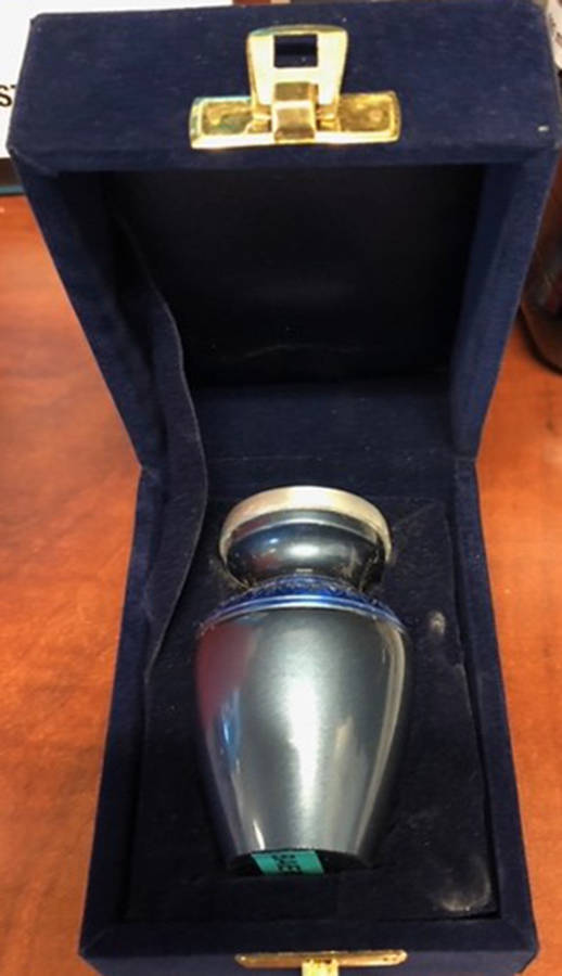 Wetaskiwin RCMP are looking for the owner of this blue urn left at the Best Western Wayside Inn in Wetaskiwin. It has the word “BAIER” on the bottom of it.                                RCMP photo