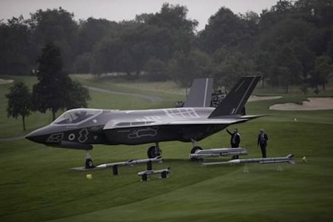 Six years after blowing up the Harper government’s plans to buy the F-35 stealth fighter without a competition, Auditor General Michael Ferguson is preparing to release a new report on Canada’s tumultuous attempts to buy new fighter jets. Men look at a demonstration F35 jet standing on display beside a golf course prior to a NATO summit at the Celtic Manor Resort in Newport, Wales, Wednesday, Sept. 3, 2014. THE CANADIAN PRESS/AP-Matt Dunham