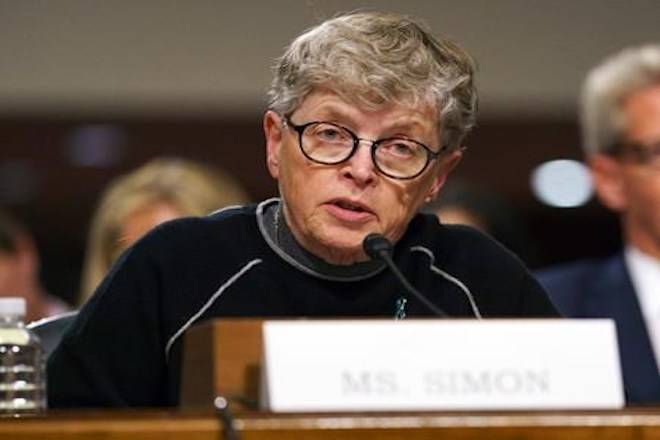 FILE - In this June 5, 2018 file photo, former Michigan State President Lou Anna Simon testifies before a Senate subcommittee in Washington. Simon has been charged with lying to police conducting an investigation of Larry Nassar’s sexual abuse. Simon, who stepped down earlier this year over the scandal, was charged Tuesday, Nov. 20, 2018, with two felonies and two misdemeanors. (AP Photo/Carolyn Kaster, File)
