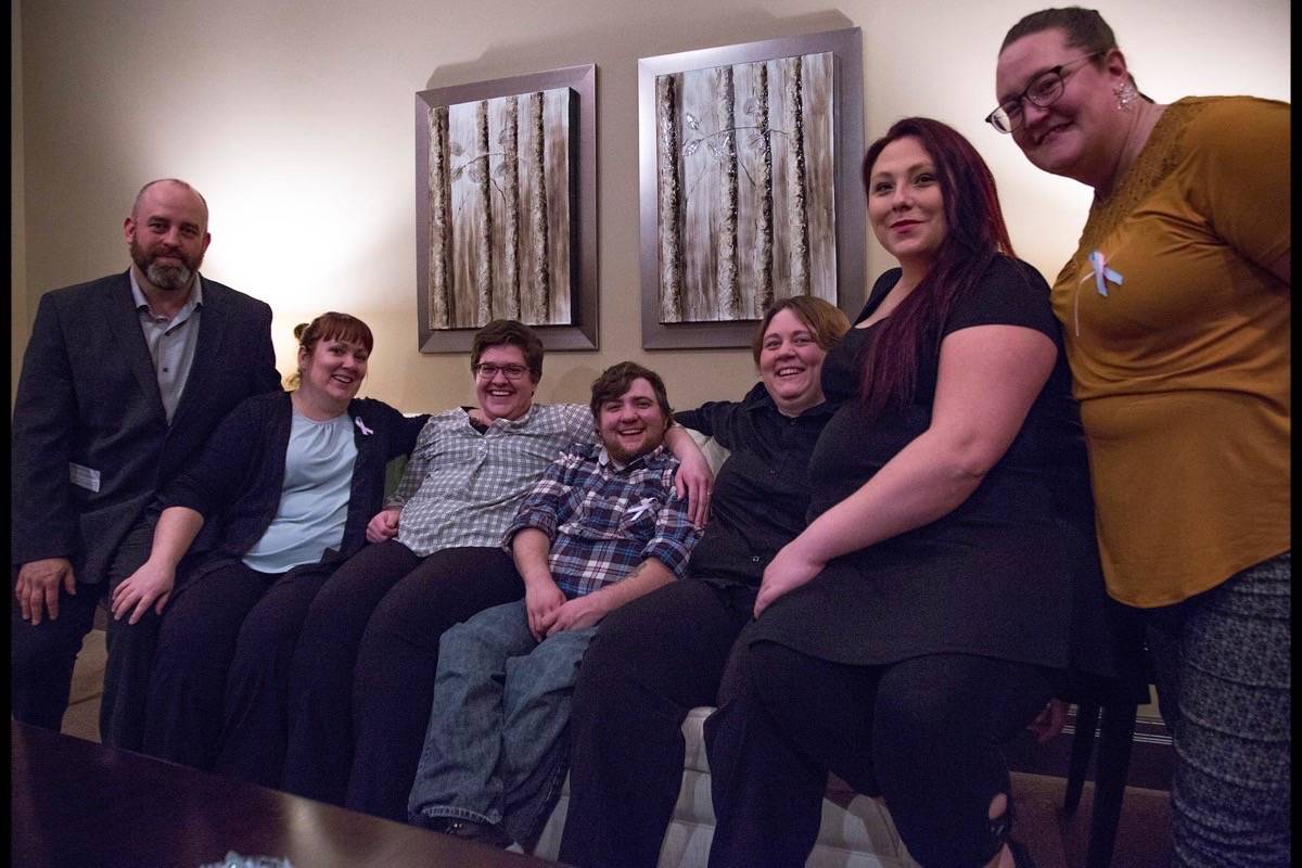 Board members with the Red Deer-based Trans and Non-Binary Aid Society (TANAS) pose for a photo after the ceremony on Transgender Day of Remembrance that remembers the transgender and non-binary individuals who have died from Nov. 21st, 2017 to Nov. 20th, 2018. The event was organized by TANAS and the Red Deer Funeral Home and Crematorium, where the event took place Nov. 20th. Robin Grant/Red Deer Express