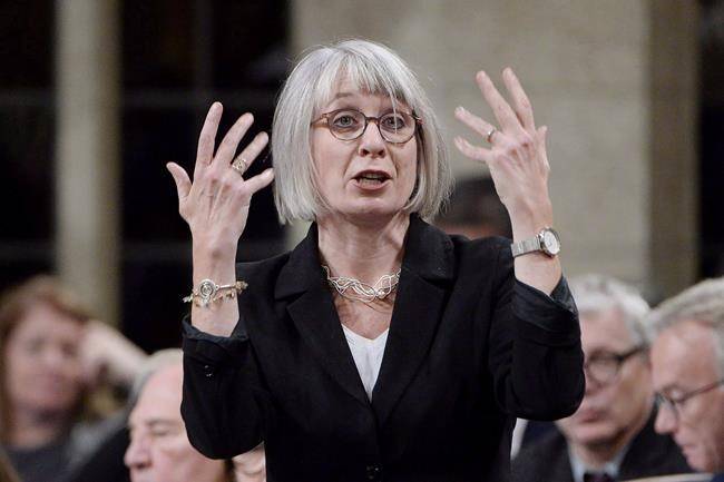 Labour Minister Patty Hajdu says the federal Liberals have given the House of Commons notice that it is prepared to order an end to rotating strikes by Canada Post employees through legislation. Hajdu rises during question period in the House of Commons on Parliament Hill in Ottawa on Tuesday, Oct. 23, 2018. (THE CANADIAN PRESS/Adrian Wyld)