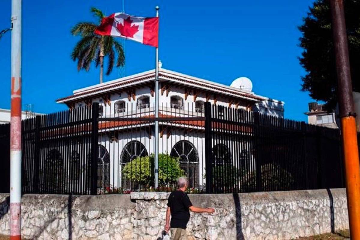A handful of Canadian diplomats who mysteriously fell ill in Cuba have been unable to return to work as investigators struggle to pinpoint the cause of their symptoms. A man walks beside Canada’s embassy in Havana, Cuba, Tuesday, April 17, 2018. (AP/Desmond Boylan)