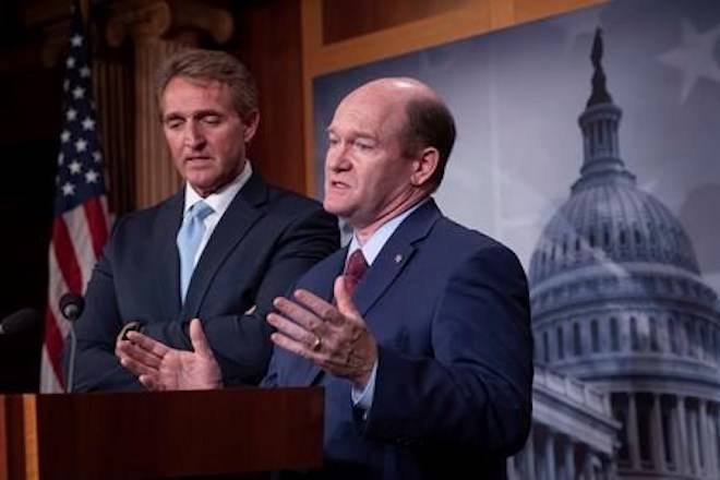 A group of U.S. senators is pushing President Donald Trump to fast-track the final text of the United States-Mexico-Canada Agreement in order to allow a vote in Congress before the end of the year. Sen. Jeff Flake, R-Ariz., left, and Sen. Chris Coons, D-Del., speak to reporters about their effort to bring up legislation to protect special counsel Robert Mueller, at the Capitol in Washington, Wednesday, Nov. 14, 2018. THE CANADIAN PRESS/AP-J. Scott Applewhite