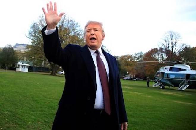 President Donald Trump waves after speaking to the media before leaving the White House in Washington, Tuesday, Nov. 20, 2018, to travel to Florida, where he will spend Thanksgiving at Mar-a-Lago. (AP Photo/Manuel Balce Ceneta)
