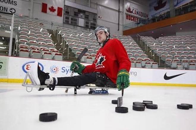 Ryan Straschnitzki takes to the ice to practice his sledge hockey skills in Calgary on Tuesday, August 7, 2018. THE CANADIAN PRESS/Todd Korol