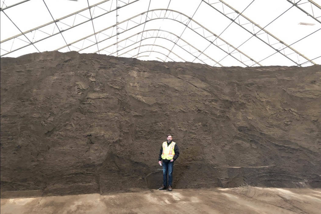 Roads Superintendent at Public Works Doug Halldorson stands in front of 12,000 metric tonnes of sand the City uses to maintain roads during the winter in Red Deer. Robin Grant/Red Deer Express