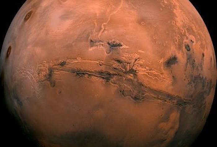 FILE - This image made available by NASA shows the planet Mars. This composite photo was created from over 100 images of Mars taken by Viking Orbiters in the 1970s. In our solar system family, Mars is Earth‚Äôs next-of-kin, the next-door relative that has captivated humans for millennia. The attraction is sure to grow on Monday, Nov. 26 with the arrival of a NASA lander named InSight. (NASA via AP, File)