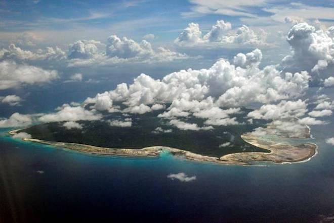 FILE -In this Nov. 14, 2005 file photo, clouds hang over the North Sentinel Island, in India’s southeastern Andaman and Nicobar Islands. (AP Photo/Gautam Singh, File)