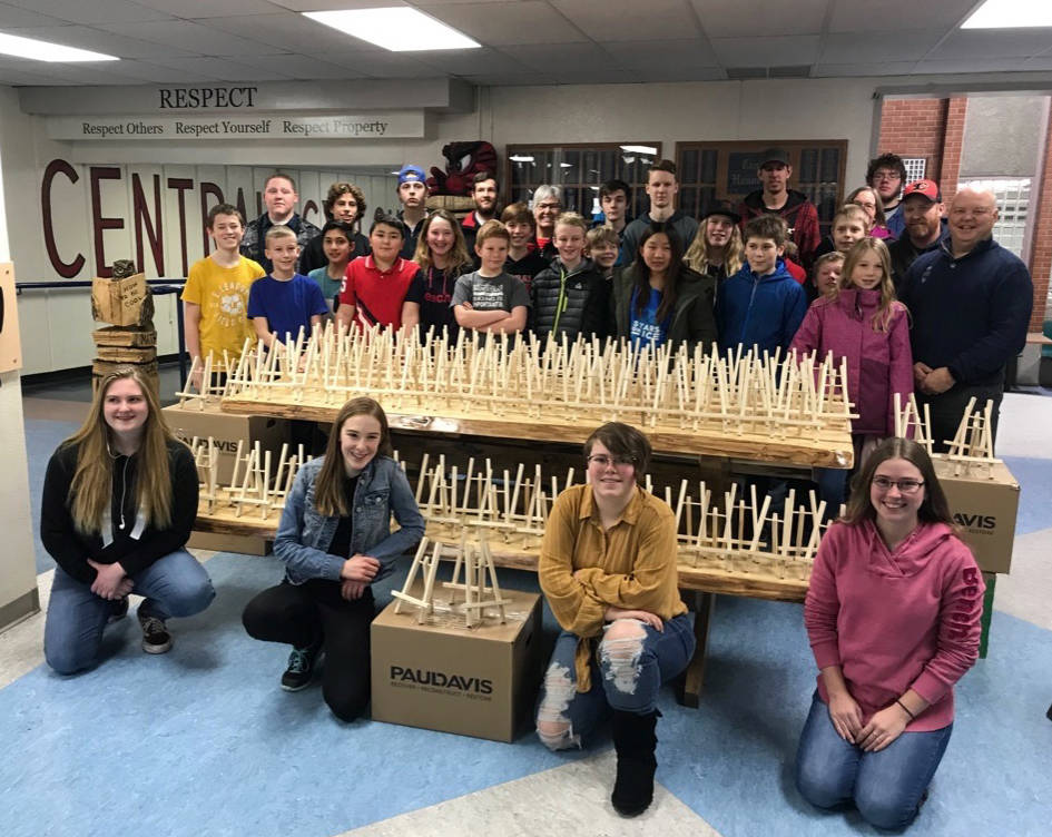 Local students pose with about 600 wooden easels they’ve made through the Saws for Schools Program. The easels will be part of a special gift for VIPs during the coming 2019 Canada Winter Games slated for February.                                Mark Weber/Red Deer Express