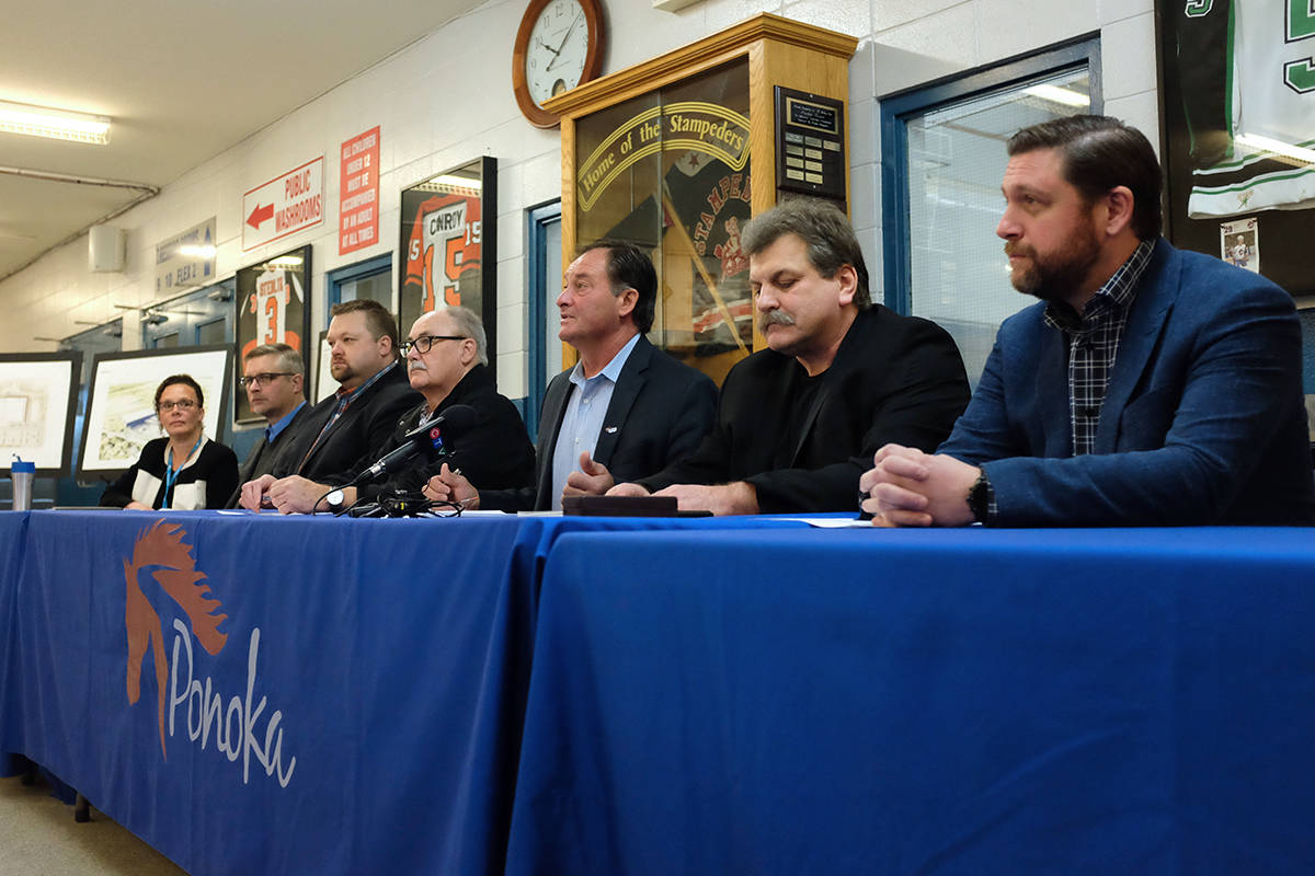 Ponoka Mayor Rick Bonnett (third from right) speaks to media Friday morning about the town’s decision to not sign off on the school tax requisition unless the province comes to the table with some grant options. Town of Stettler Mayor Sean Nolls (far right) was also in attendance to show his support. Photo by Jeffrey Heyden-Kaye