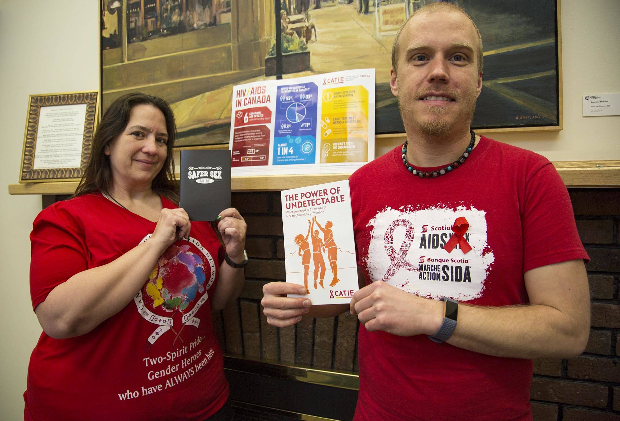 Program manager at Shining Mountains Living Community Services Kandace Ogilvie and Kevin Cunningham, a health promotion outreach worker at Turning Point, hold up information pamphlets about HIV treatment and prevention. Both Turning Point and Shining Mountains held an awareness walk on the 30th anniversary of World AIDS Day Saturday. Robin Grant/Red Deer Express.