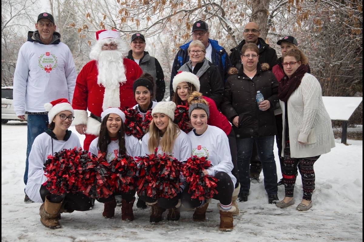Volunteers with the Santa Shuffle Fun Run and Elf Walk, including members of the Lindsay Thurber Raiders cheer team, pose for a photo Saturday morning. Run Director Taylor Poor said the event raised over $7,000. Robin Grant/Red Deer Express
