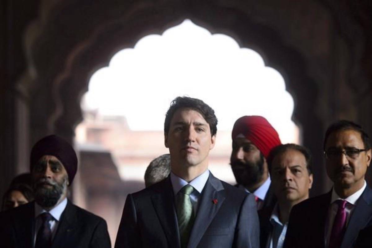 Prime Minister Justin Trudeau visits the Jama Masjid Mosque in New Delhi, India on Thursday, Feb. 22, 2018. The national security committee of parliamentarians says there is no systematic vetting of guest lists for foreign events involving the prime minister. (Sean Kilpatrick/The Canadian Press)