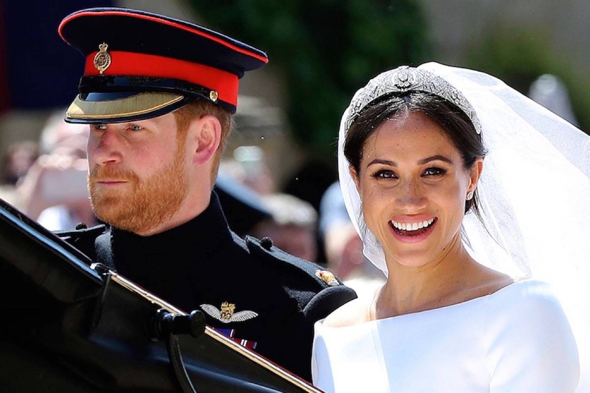 Britain’s Prince Harry and his wife Meghan Markle leave after their wedding ceremony, at St. George’s Chapel in Windsor Castle in Windsor, near London, England, Saturday, May 19, 2018. (Gareth Fuller/pool photo via AP)